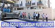 AKSULULAR TOZLU YOLLARDAN KURTULUYOR